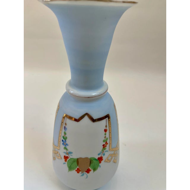 Beautifully decorated sky-blue and white French Art Deco vase with hand-decorated floral motif with gold gilt accents....