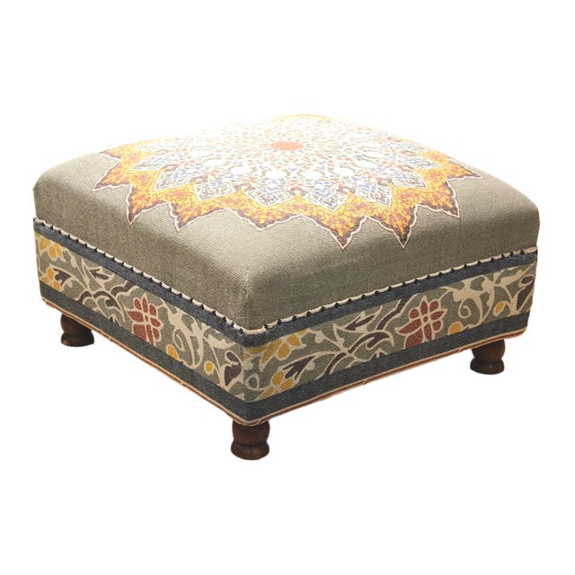 This ottoman has a colorful mandala pattern fabric with a complementary floral motif encircling the lower portion. Its...