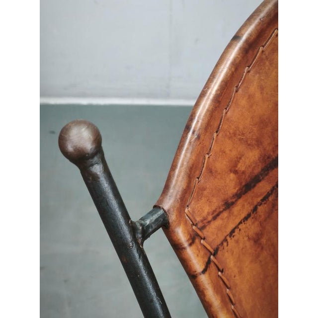 1990s European Brutalist Wrought Iron and Hand-Stitched Cognac Leather Dining Chair An exceptional European Brutalist-...
