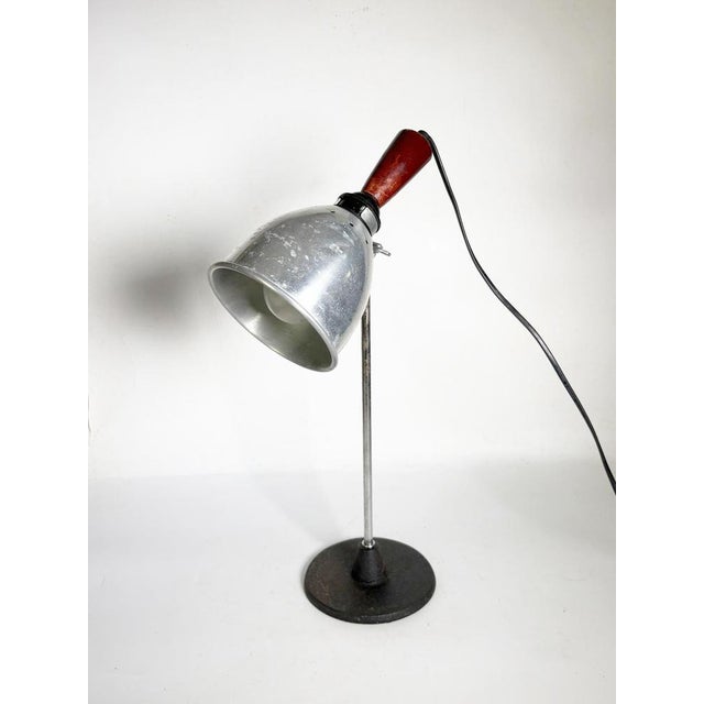 Industrial table lamp with aluminum shade, France, 20th century. This industrial-style table lamp combines functionality...