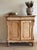 This antique French commode/sideboard is a beautifully worn piece, full of quiet detail and centuries of use. Crafted in...