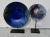 Balance pair of blue enamel dishes mounted at visual decorations. Brillant glowing metallic blues and silvers across the...