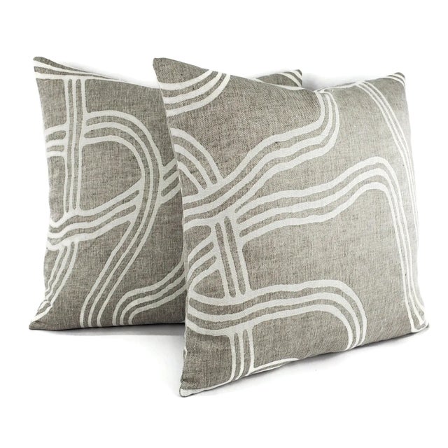 This pillow features gray and white threads that have been woven into a wave strokes swirl pattern. Unique and soft to the...