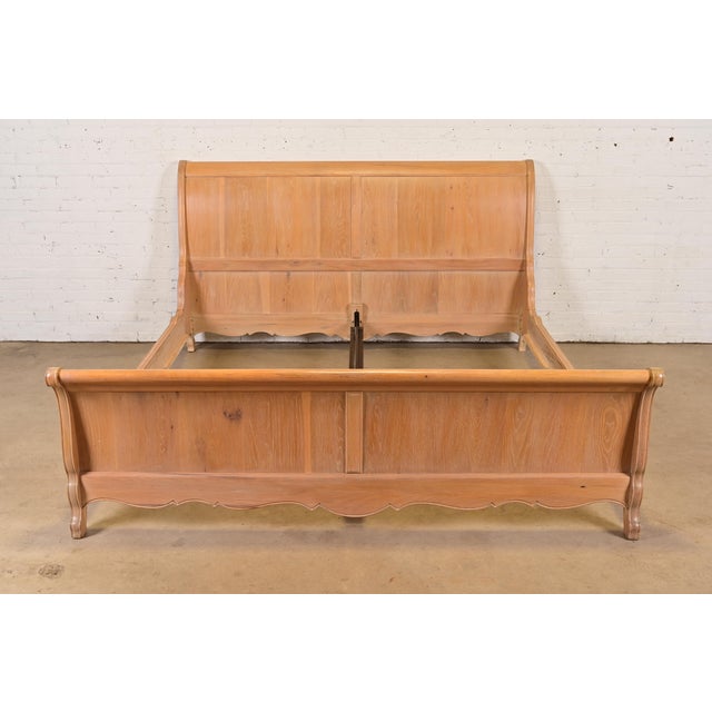 A gorgeous French Louis Philippe or French Country style carved oak king size sleigh bed By Thomasville USA, Late 20th...