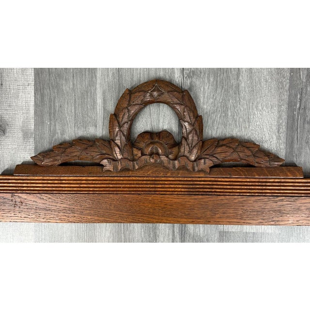 Antique French Hand Carved Wood Solid Oak Pediment - Crown The intricate craftsmanship of the solid oak wood in a dark...