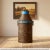 Dimensions: 14" W x 14" D x 29" H This is a vintage milk can or milk churn made from galvanized iron. It wears the...
