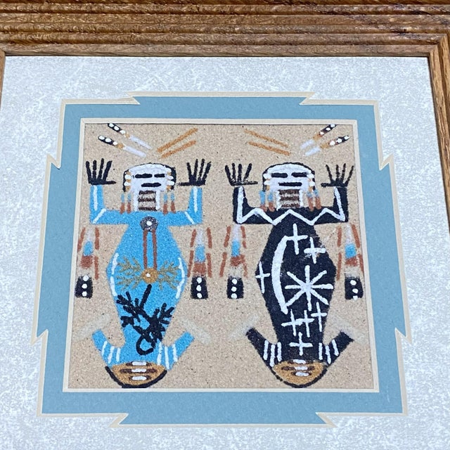 An authentic Navajo sandpainting by artist Alvina Begay, featuring a beautifully detailed Yeibichai (Navajo Holy People)...