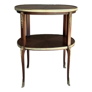 Circa 1930 Louis XVI-Style Mahogany Starburst Marquetry Two-Tier Oval Accent Table With Brass Mounts For Sale