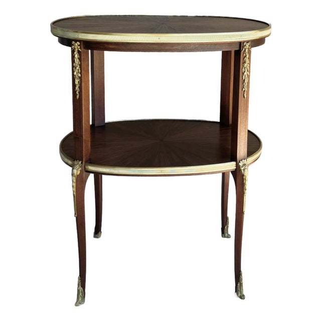 Circa 1930 Louis XVI-Style Mahogany Starburst Marquetry Two-Tier Oval Accent Table With Brass Mounts For Sale