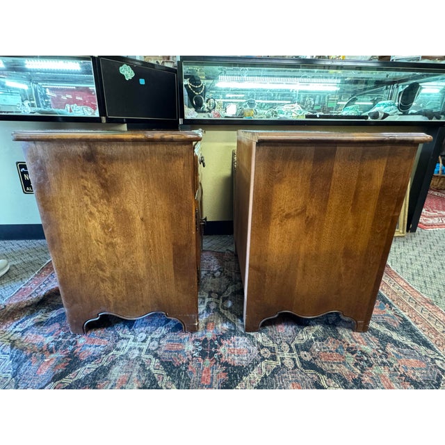 Pair of Ethan Allen french provincial nightstands, walnut in excellent condition , minor wear form use. Nightstands are...