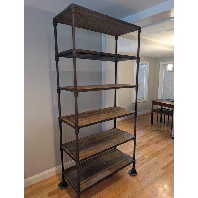 Sourced from Restoration Hardware's Dutch Industrial collection, this shelving unit pairs hand-selected reclaimed elm with...