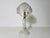 This vintage Art Deco table lamp from the 1940s is a stunning example of the era’s artistic design and craftsmanship. Made...