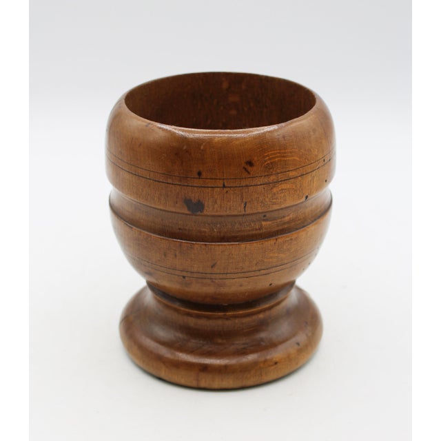 Late 18th century treen mortar & pestle, English. Hand turned from a block of warmly colored yew wood. Together with an...