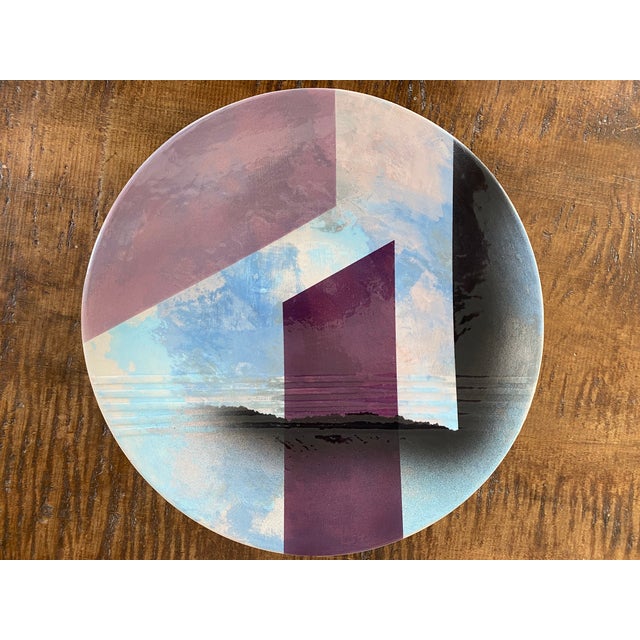 A wonderful late 1980s pottery charger by John Bergen Studio. The charger features a bold Art Deco inspired graphic design.