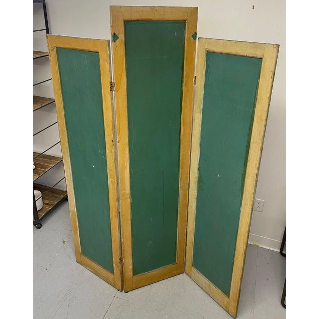 Three Pane Room Divider , Painted Green on one Side with a Floral Motif on the Other. Edges are Yellow , the Top of the...