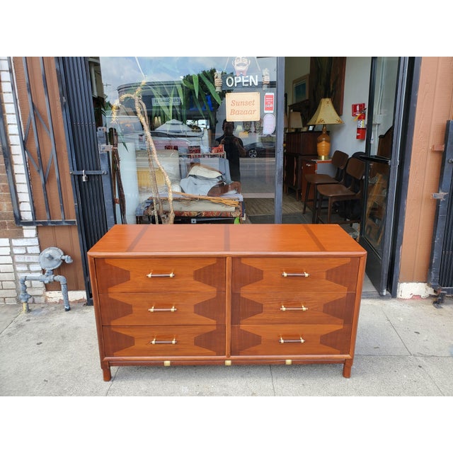 Vintage mid-century dresser made by Thomasville from the Talisman line. The dresser has six drawers, all open smoothly and...