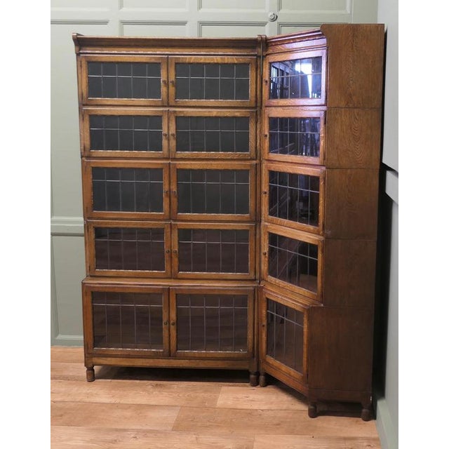 This Oak Bookcase has a slight waterfall shape when fully assembled it fits into a corner in 2 pieces. The sections of the...