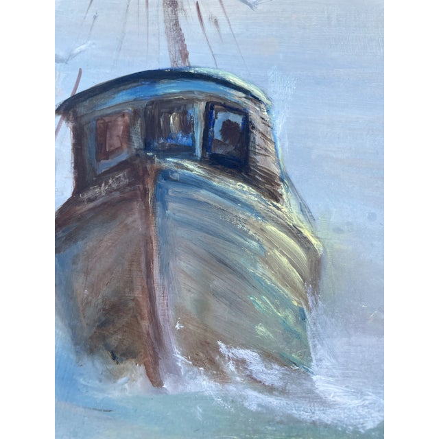 A signed vintage nautical painting on board featuring a trio of fishing boats on the sea. The painting features a hazy...