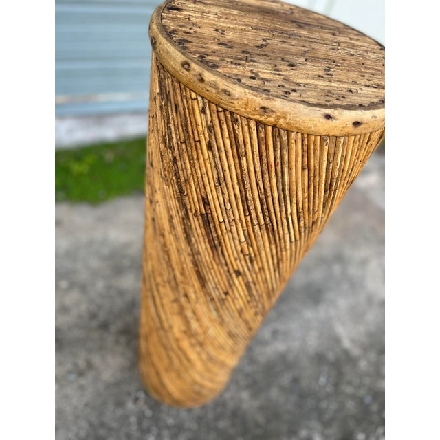 Tall and round pedestal, spiral-wrapped in a distressed rattan. In the Style of Gabriela Crespi. A Boho-Chic style with a...