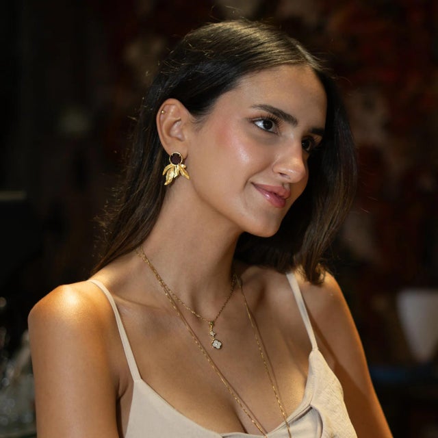 Add a touch of earthy elegance to your look with the Mocha Feather Cat Eye Stud Earrings. Featuring a rich mocha cat eye...