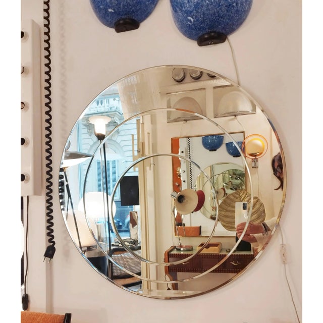 Elegant and refined round mirror in ground crystal with three different layers of mirror, Rimadesio, Italy 1970s. This...