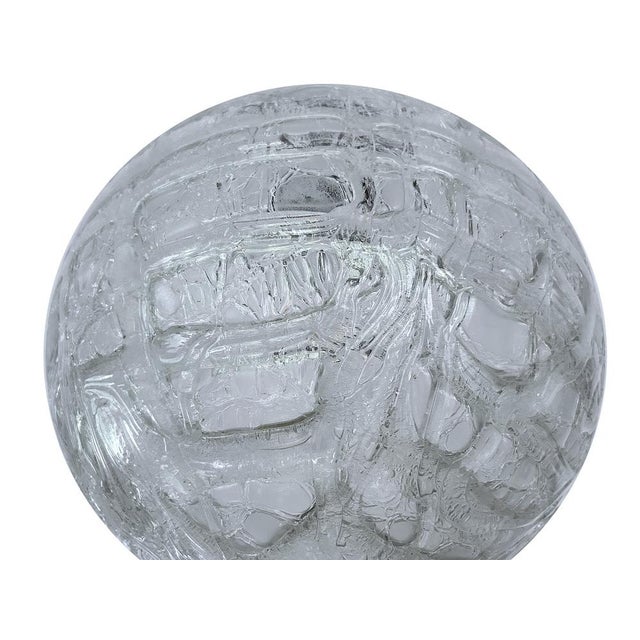 Large Mid Century Doria Murano pendant light featuring a murano glass globe shade with signature random lava flow style...
