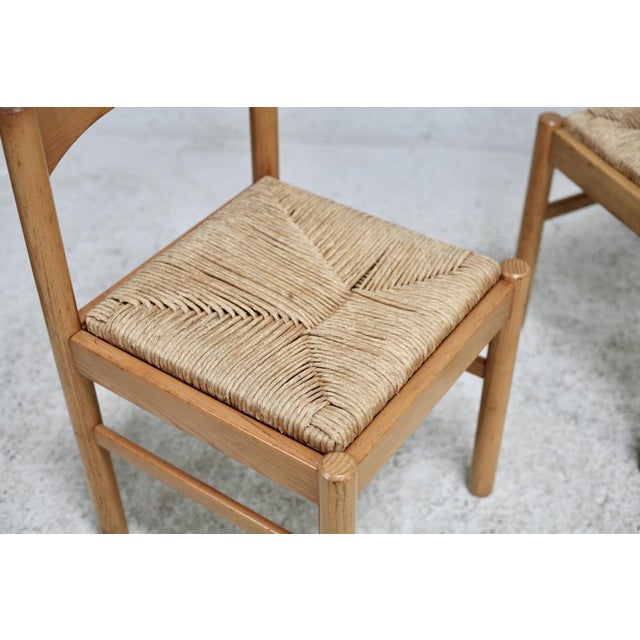 Pair of straw chairs. France, circa 1960 Solid and stable. traces of original glue with small file spaces. Without...