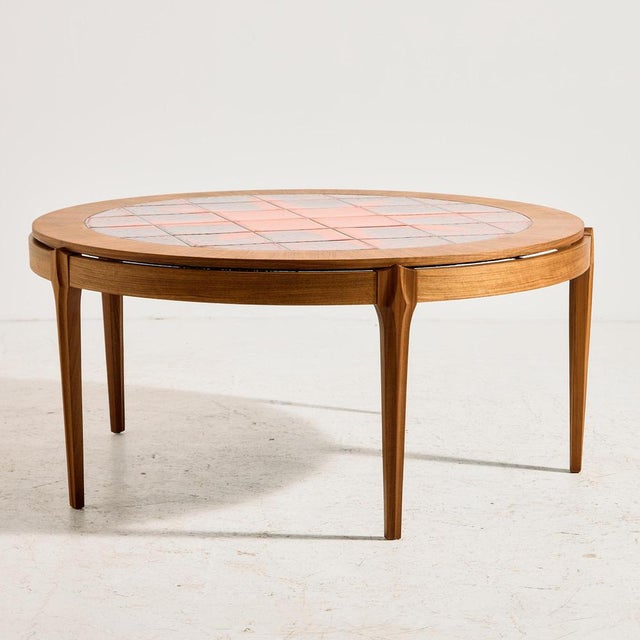 Walnut coffee table with glazed ceramic top from the 1970s. The table has special joints and has been completely restored.