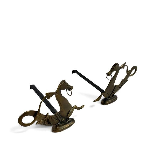 Rare Pair of 19th-Century Fire Dogs Featuring Seahorses A rare and elegant pair of 19th-century fire dogs, adorned with...