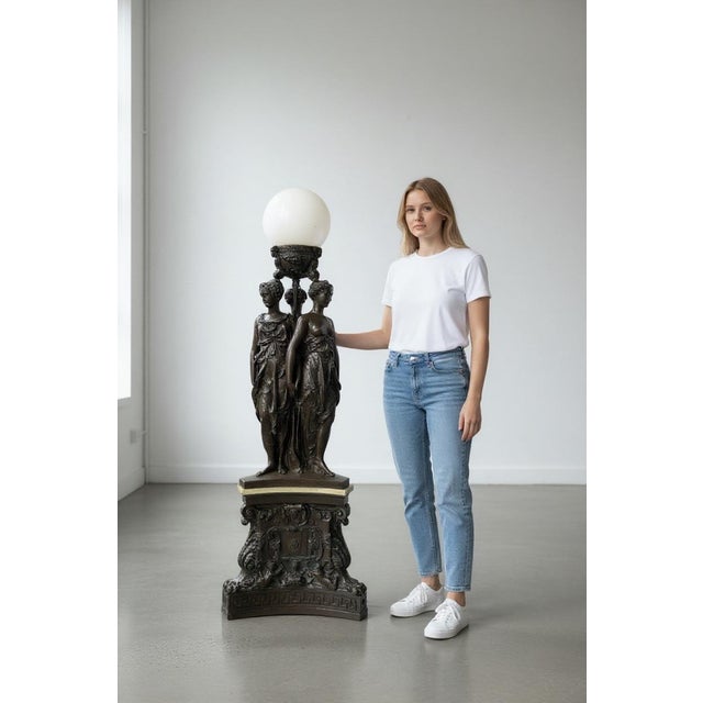 A Palatial French Patinated Bronze Sculpture Of the Three Graces On triangular bronze pedestal. By Barbedienne Foundry....