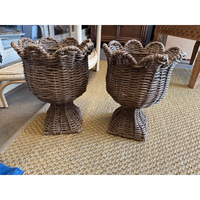 Gorgeous pair of handmade in the Philipines wicker footed jardinieres with scalloped edges.