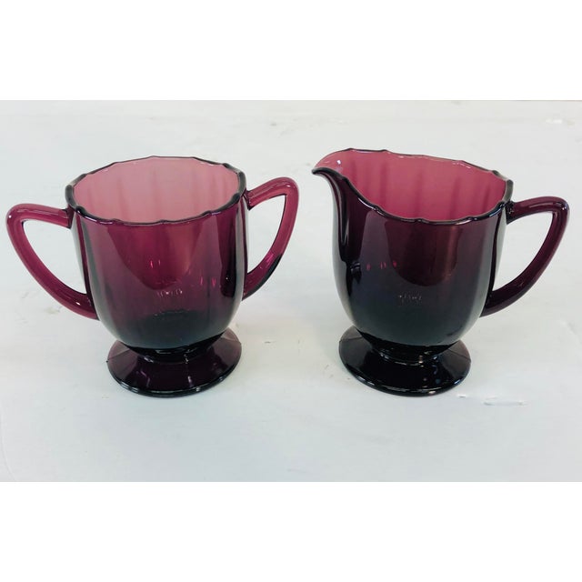 Vintage Art Deco style amethyst glass sugar and creamer set. Excellent condition. No marks.