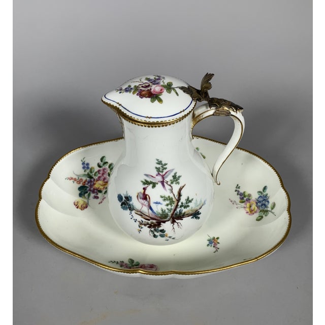 Covered water jug ​​and oval basin in soft-paste sèvres porcelain, 18th century, dated 1757 a large, turned water jug,...