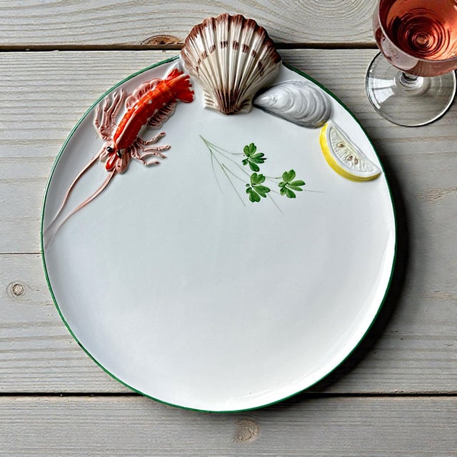 A striking set of ten Italian hand-made ceramic plates, each measuring approximately 10 inches in diameter, decorated with...