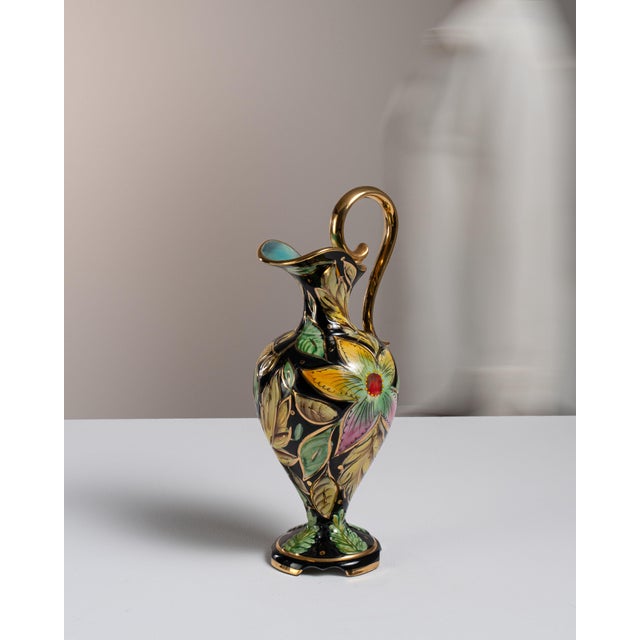 This mid 20th century jar from Belgium is finished in green, worked in ceramic. Its form follows honest, well-proportioned...
