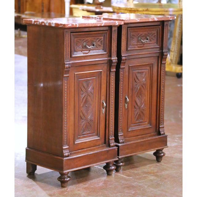 Decorate a bedroom with this elegant pair of antique French nightstands, crafted circa 1870 in the Louis XIII style. Each...