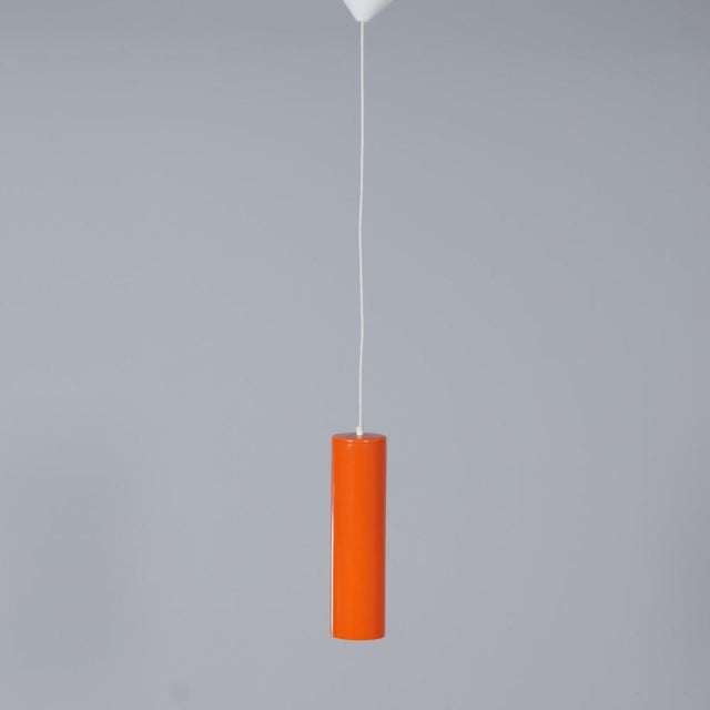 Venini 486b pendant lamp by paolo venini for venini & c., produced on murano in 1962. The orange glass exterior with white...