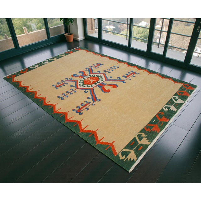 Woven in the 1980s as a limited-edition series within Oushak workshops, this stunning flatweave stays true to classic...