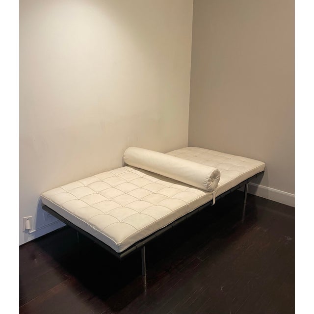 Leather day bed with wooden and metal frame and removable cushions. Comfortable for lounging or as an guest bed maker unknown