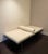 Leather day bed with wooden and metal frame and removable cushions. Comfortable for lounging or as an guest bed maker unknown