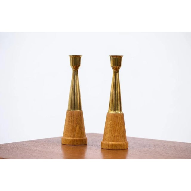 Pair of candleholders from unknown maker, most likely Scandinavian from the 1960s. Made from brass and oak.