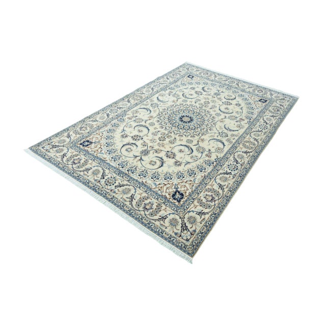 This exclusive Nain 9La oriental rug measures 308 x 198 cm and is one of the finer classifications (9La), which means a...