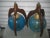 Midcentury walnut and blown blue glass Pearsall lamps. They have a 16 inch high walnut three prong exterior with a blue...