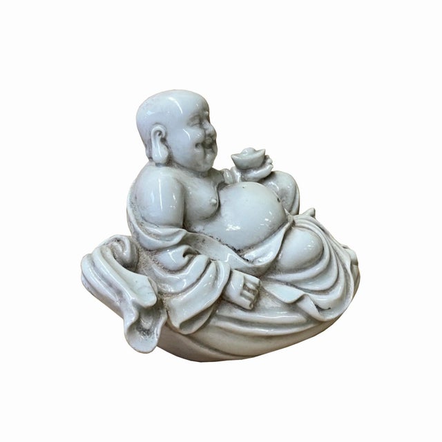 This is a Chinese Happy Buddha statue in off-white color porcelain with a vintage rustic finishing touch. She is in a...
