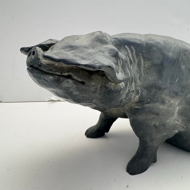 Add character, charm, and sculptural interest to your space with this delightful pair of vintage House of Parts pig...