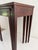 Set of vintage mahogany nesting tables in the style of Henkel-Harris, featuring rectangular tops with inset glass panels,...