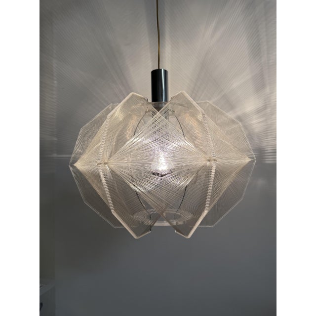 Clear Wire Hanging Lamp by Paul Secon for Sompex, Germany, 1970s, in Good conditions. Designed 1970 to 1979 This piece is...