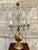 Gilt wood vase-shaped, six-light pinwheel lamp with iron arms, bobeches and crystal pendants H cm 65 base cm 13 x cm 13...