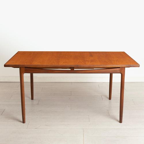 A midcentury teak extending dining table and six chairs from the danish design range by ib kofod-larsen for g plan, dating...