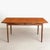 A midcentury teak extending dining table and six chairs from the danish design range by ib kofod-larsen for g plan, dating...